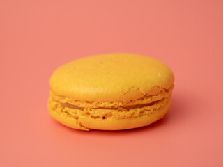 Colorful French macaroons on a pink background. French macaroons close-up.