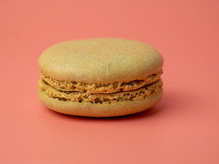 Colorful French macaroons on a pink background. French macaroons close-up.