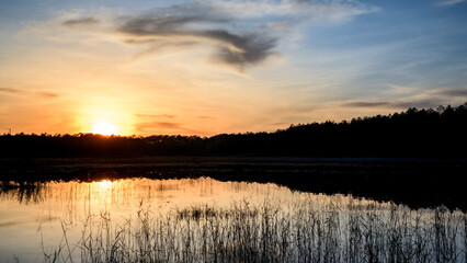 Obraz premium Colorful Sunsets over water