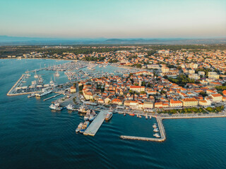Biograd na Moru, marina aerial view, port with sailing boats and luxury yachts in sunlight. Summer...