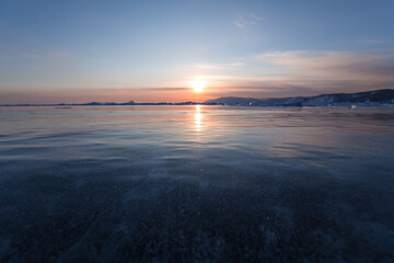 Fototapeta premium Gas methane bubbles frozen in blue ice of lake Baikal