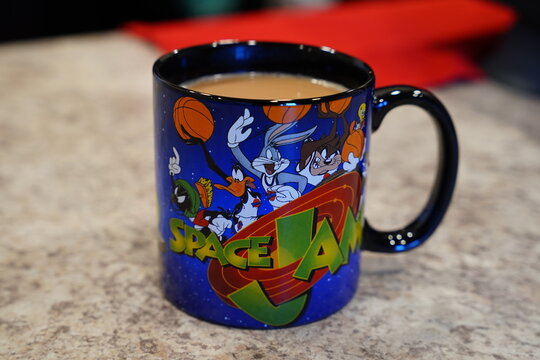 Looney Tunes Space Jam coffee Mug with coffee inside.