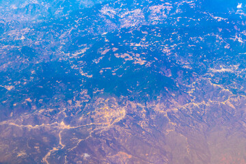 Flying airplane over Mexico Clouds Sky Volcanoes Mountains City desert.