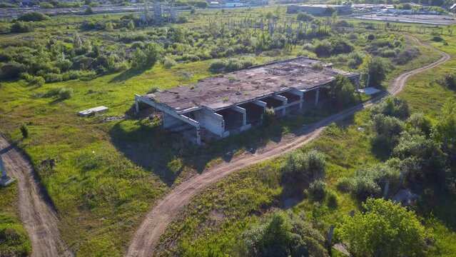 Abandoned building in a field on a sunny day. High quality 4k footage