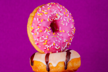Set of doughnuts on colored background.