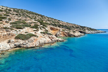 Rocky coastline in Schinoussa island, Greece, one of the Lesser Cyclades islands, close to Naxos, in Cyclades islands of the Aegean sea, Greece