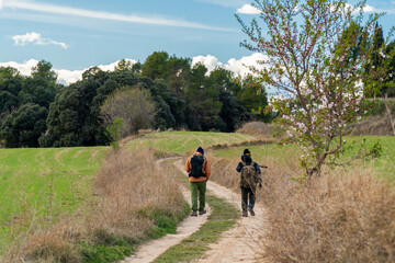 Fototapeta na wymiar Two hikers walking on a beautiful path