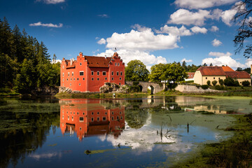 Naklejka na ściany i meble The Cervena (Red) Lhota Chateau is a beautiful and unique example of Renaissance architecture. It is located in the South Bohemian Region of the Czech Republic, surrounded by a picturesque lake.