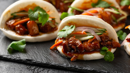 Bao buns with pork belly and vegetable. Asian cuisine