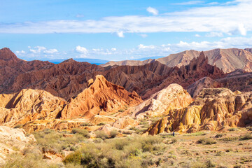 landscape of Skazka canyon on Issyk-Kul lake. Rocks Fairy Tale famous destination in Kyrgyzstan. Mountain like great wall of china and Rainbow Mountains of Danxia or Antelope crevice USA. Central Asia
