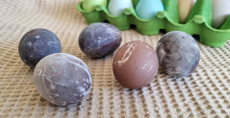 Fototapeta na wymiar Dyed Easter eggs in red wine