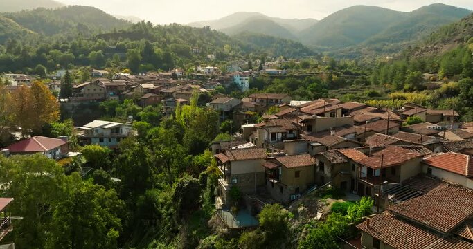 Aerial view Kakopetria Cyprus cityscape. Beautiful landscape of a mountain village surrounded by mountain ranges, architecture of houses. High quality 4k footage