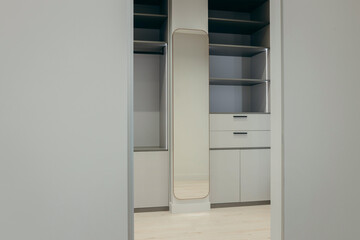 Modern dressing room with mirror in apartment