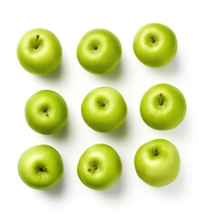 Fresh Granny Smith Apples Arranged Neatly Against White Background in Daylight