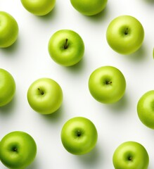 Fresh Granny Smith Apples Arranged Neatly Against White Background in Daylight