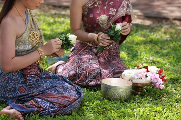 Foto op Canvas Young beautiful asia woman with Traditonal Thai dress hold lotus flower and Silver Bowl to to temple , Songkran festival concept at Wat Phra Si Sanphet, Ayutthaya © naraichal