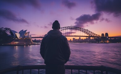 Man Contemplating the Sydney Harbour Bridge at Sunset