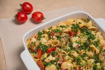 Casserole with pasta and herbs in a large dish