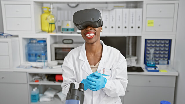 African american woman scientist conducting medical research in lab, using cutting-edge virtual reality glasses for a dynamic video call