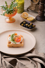 Viennese waffle with salmon and butter cream. holiday breakfast