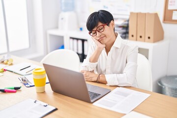 Middle age chinese woman business worker tired working at office