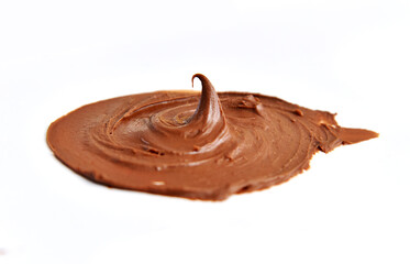 Swirl smear of chocolate paste on a white background