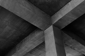 Abstract dark concrete construction background, ceiling with girders