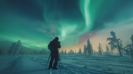 Foto op Canvas Capturing the Arctic Glow Photographer in Snowy Wilderness with Northern Lights © Dimitri