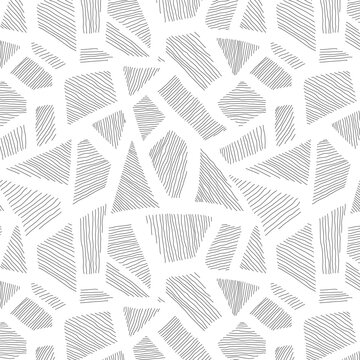 Seamless black and white pattern of scribbled patchy mosaic with fuzzy freehand texture. Minimalist grunge doodle background.
