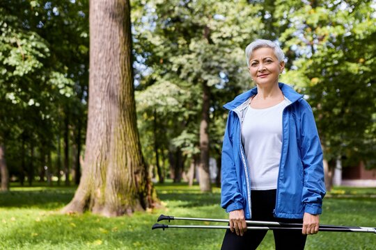 Summertime Shot Beautiful Stylish Elderly Training Outdoors Holding Ski Poles With Both Hands Going Have Scandinavian Walking Energy Activity Wellness Aged People Sports Concept