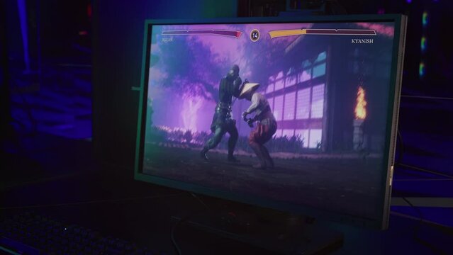 Wide computer screen displaying the ongoing fight in the melee combat game. Gaming screen showing the fight between digital characters. Playing the versus fighting game on the gaming screen.