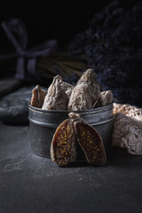 Close up of dried figs and dried lavender in the background.