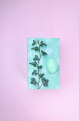 gift box with Easter egg and ivy