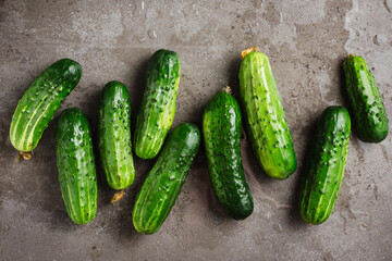 Fresh cucumbers on dark background.
