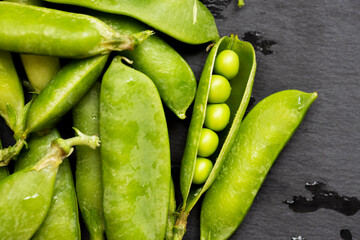 Fresh Green Peas on Slate Background