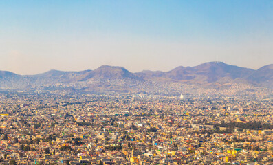 Flying airplane over Mexico Clouds Sky Volcanoes Mountains City desert.