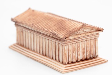 greek temple model toy on a white background