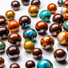 shiny spheres of chocolate on white background