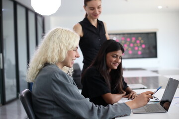 Business People, Successful business professionals. Diverse team celebrating business success at meeting.