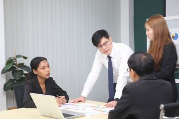 Business People, Successful business professionals. Diverse team celebrating business success at meeting.