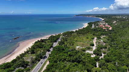 Fototapeta premium Curuipe Beach In Porto Seguro Bahia Brazil. Idyllic Beach. Nature Landscape. Bahia Brazil. Tourism Background. Curuipe Beach In Porto Seguro Bahia Brazil. Peaceful Scenery Of Tourism.