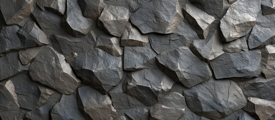 A black and white image showcasing a seamless texture of a grey concrete stone background, featuring a rugged rock wall.