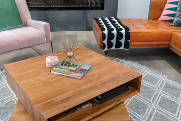Mid-century modern wooden coffee table with books