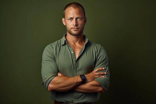Portrait of a handsome man in a green shirt. Men's beauty, fashion.