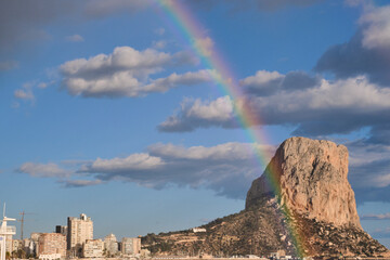 Panoramic view of the Natural Park Peñón de Ifach with a beautiful rainbow. Parc Natural del Penyal d'Ifac. Calp, Alicante, Spain.