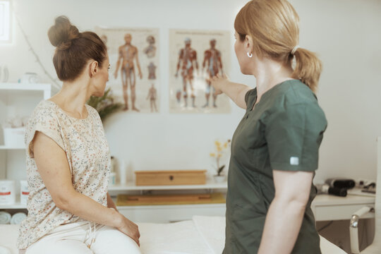 female massage therapist conduct educational training