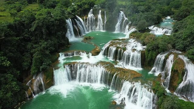 Ban Gioc waterfall in green mountains , Asia, northern Vietnam, Cao Bang, towards Lang Son, in summer on a sunny day.