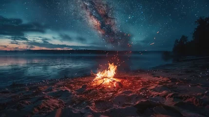 Fotobehang Night camping on shore. campfire under evening sky full of stars and Milky way on blue water and forest background. Outdoor lifestyle concept © buraratn