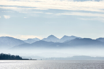 View at lake chiemsee, bavaria, germany, in late winter, february. Chiemgau alps are seen in the background