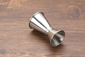 Jigger Measure, metal bar instrument or measuring cup 
